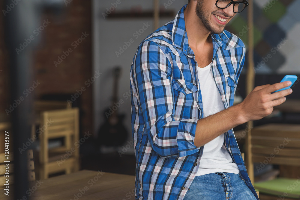 man using his smartphone with smile man using his smartphone with smile