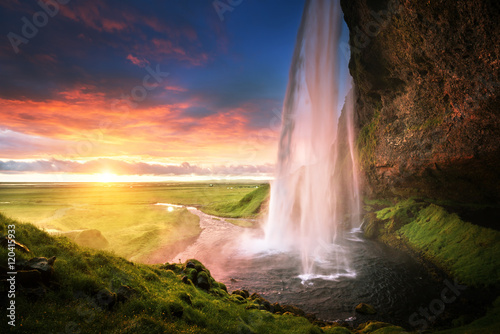 Seljalandsfoss waterfall at sunset  Iceland