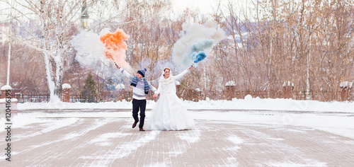 Bride and groom have fun on their winter wedding © satura_