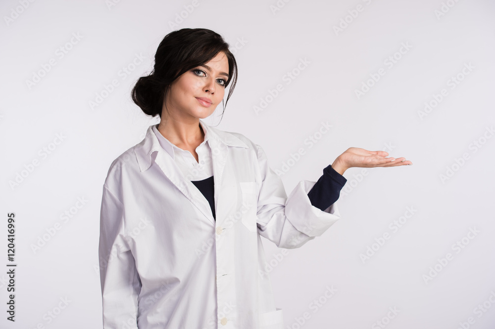 Pointing to blank copy space woman doctor nurse over white background Pointing to blank copy space woman doctor nurse over white background