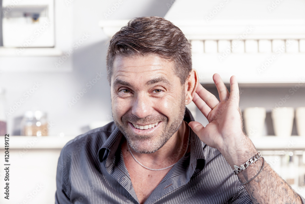 handsome man makes gesture of not having understood handsome man makes gesture of not having understood