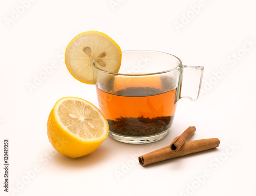 Tea in glass mug, lemons and spices, cinnamon, anise © Goncharenya Tanya