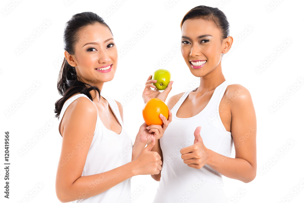 Asian friends eating fruit living healthy Asian friends eating fruit living healthy