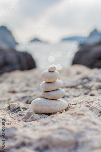Photography Balance stone on sea coast. Zen rocks on the beach
