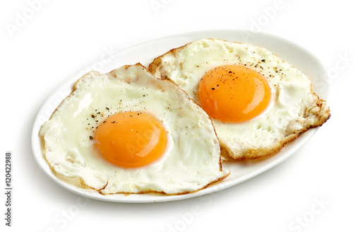 fried eggs on white background