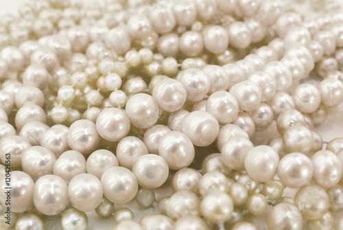Pearl necklace. Shiny jewellery background 