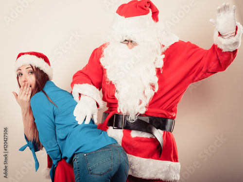 Fotografie Attractive lady with Santa Claus.