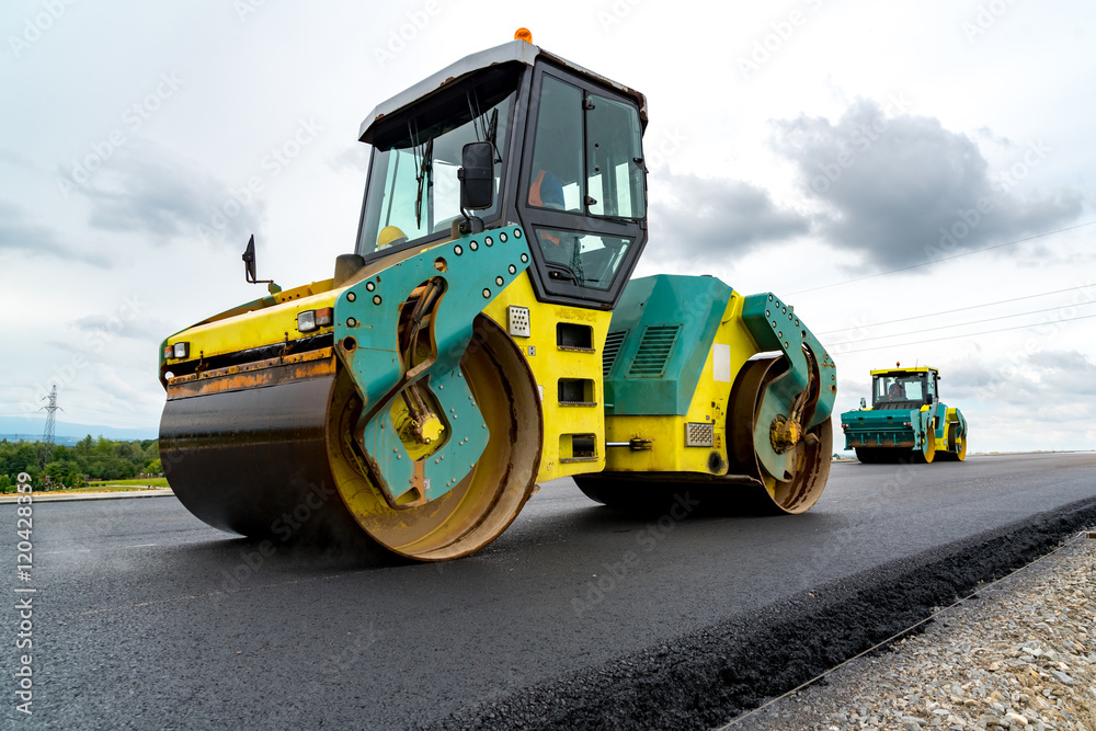 Road roller working on the construction site Road roller working on the construction site