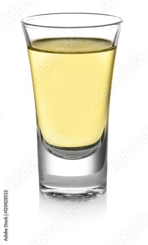 Shot of gold tequila isolated on white