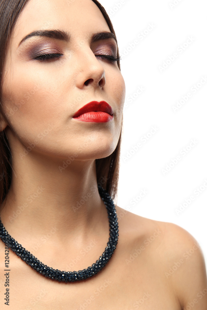 Portrait of beautiful young woman with bright makeup on white background