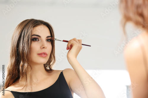 Young beautiful woman doing...