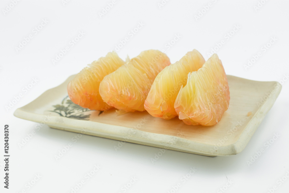 pomelo on rectangle dish isolated