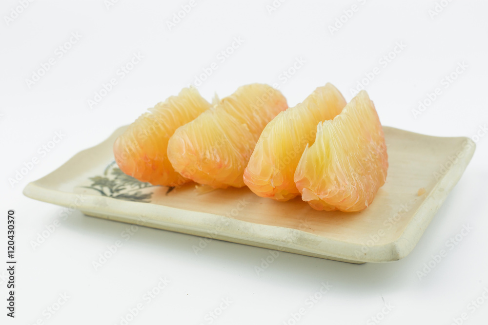 pomelo on rectangle dish isolated pomelo on rectangle dish isolated