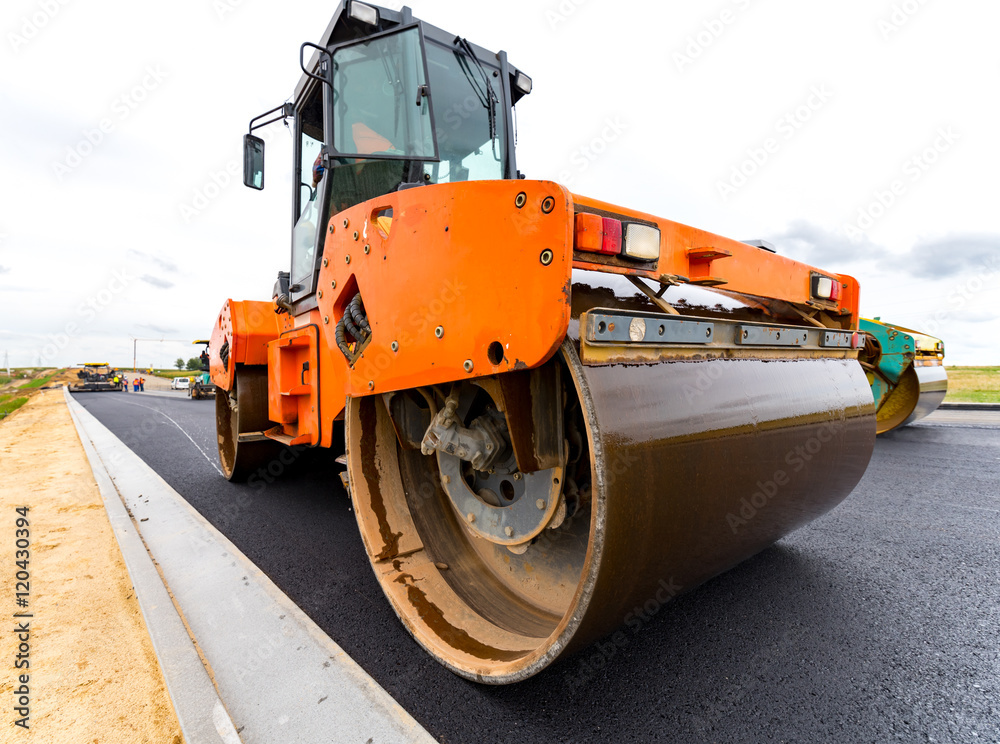 Road roller working on the construction site Road roller working on the construction site