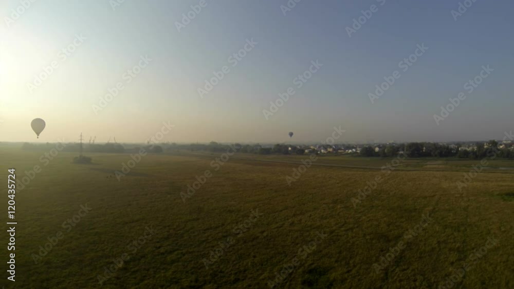 Early morning flight in hot air balloon. Top view Early morning flight in hot air balloon. Top view
