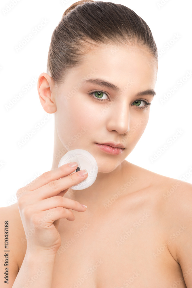 Young girl cares for face skin relaxation. Beautiful young brunette woman with clean perfect fresh skin using cotton pad. Youth and skin care concept. Isolated on a white. Young girl cares for face skin relaxation. Beautiful young brunette woman with clean perfect fresh skin using cotton pad. Youth and skin care concept. Isolated on a white.
