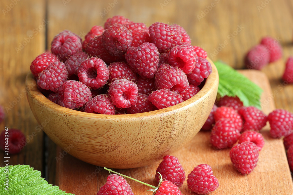 Fresh raspberry on the wooden table Fresh raspberry on the wooden table