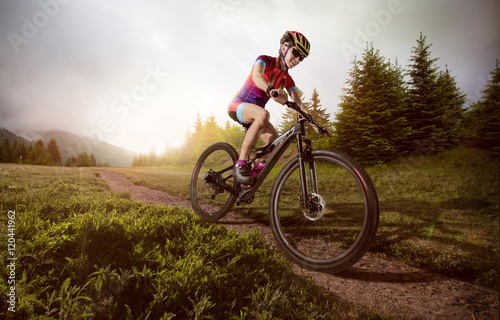 Sport. Mountain Bike cyclist riding single track.