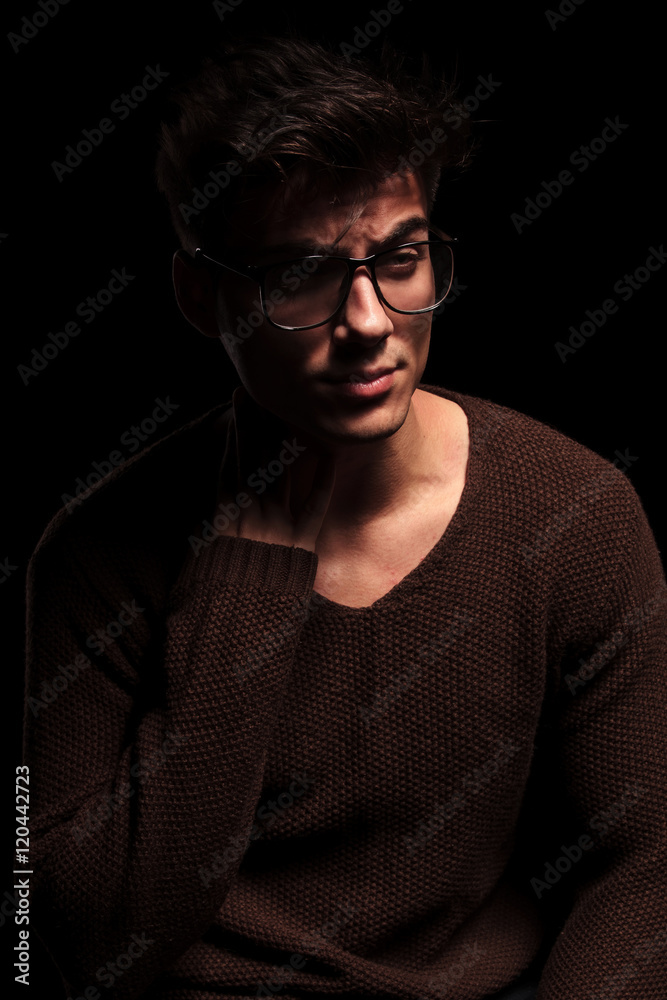 fashion attractive young man with glasses looking away