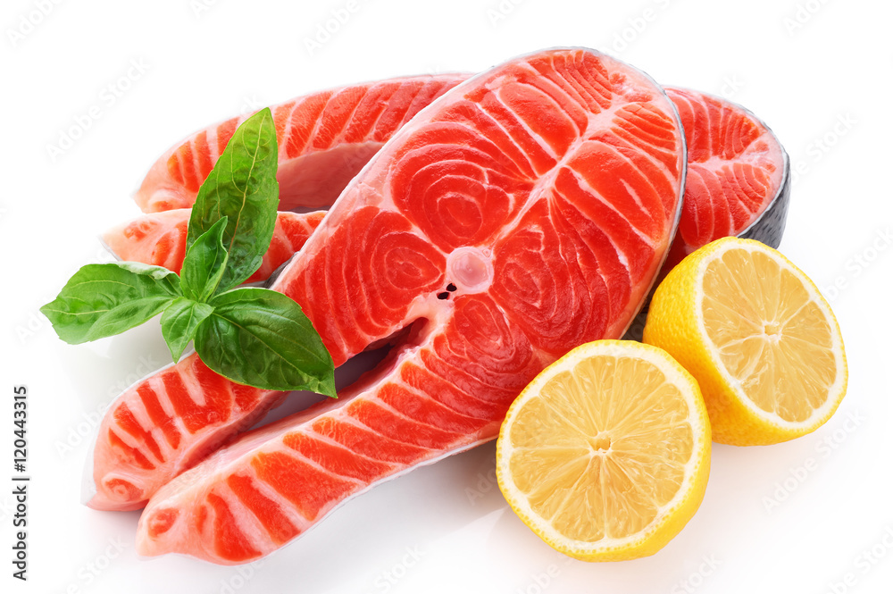 Fresh salmon with lemon and basil isolated on white background Fresh salmon with lemon and basil isolated on white background