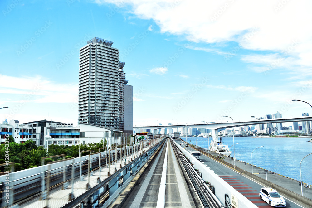 Picture inside a commuter train in Tokyo aproaching the end of Odaiba's Rainbow bridge.