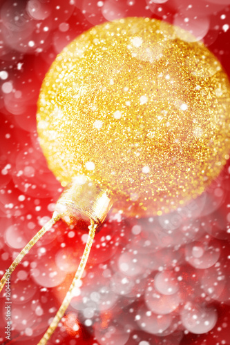 Christmas Golden Ball Close Up over Red