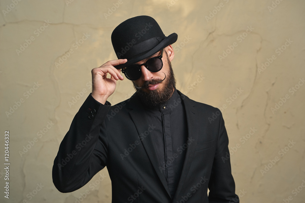 Bearded Man with black Clothes greets