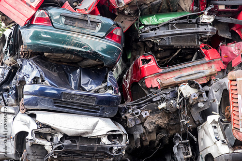pile of discarded scrap car on a junkyard, concept for insurance or waste management