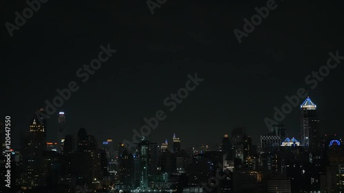 Wallpaper Mural Lightning striking in dark night sky over the illuminated highrise buildings and skyscrapers of Bangkok city, Thailand Torontodigital.ca