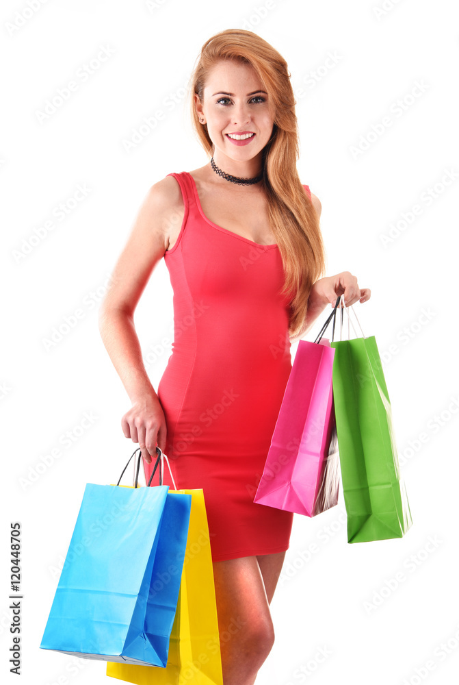 Young woman with shopping bags isolated on white Young woman with shopping bags isolated on white