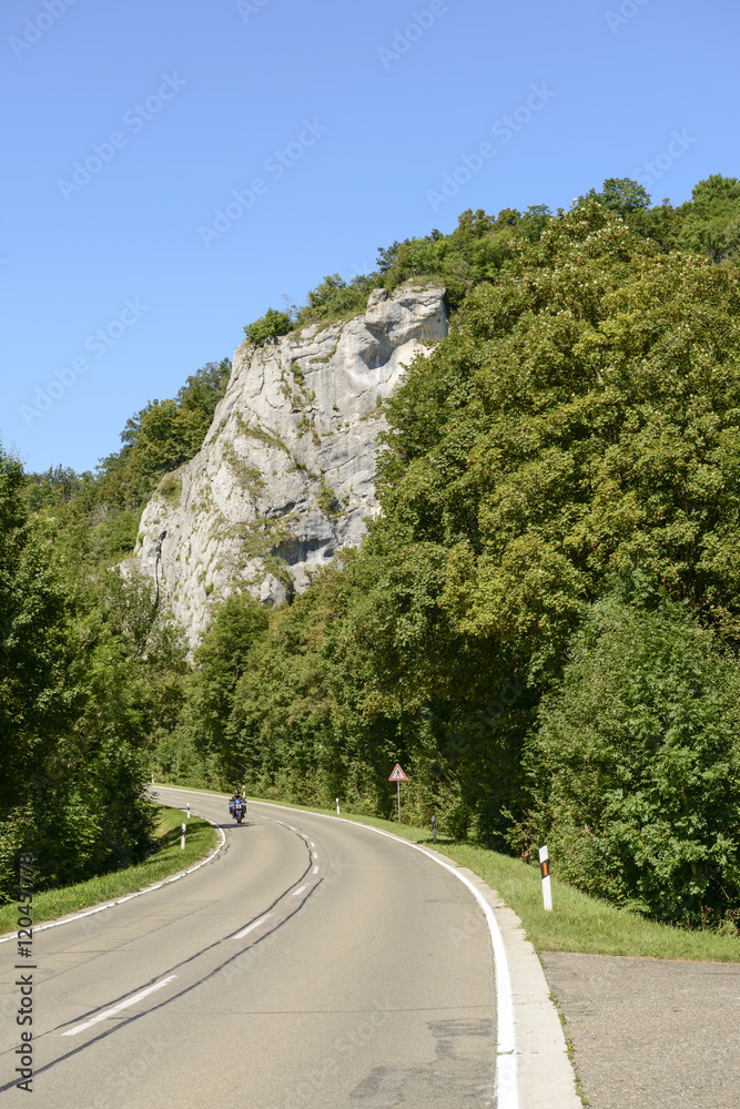 road bends under cliffs in Donau valley near Inzigkofen, Germany