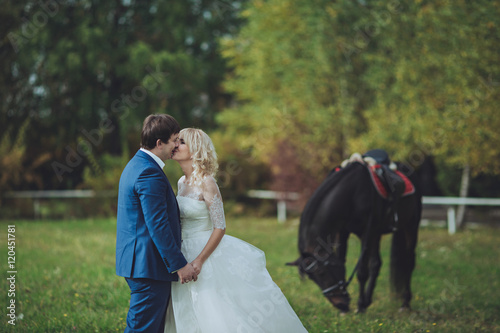 bride and groom kissing  in fourest © andriychuk