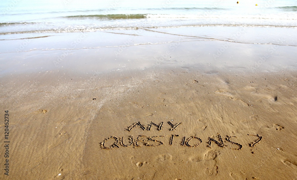 Fototapeta premium Any Questions writing on the beach sand