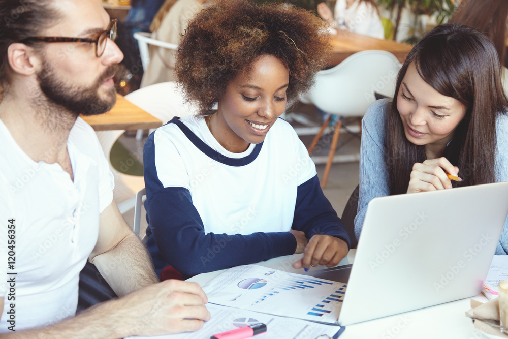 Portrait of three students of different races preparing for next