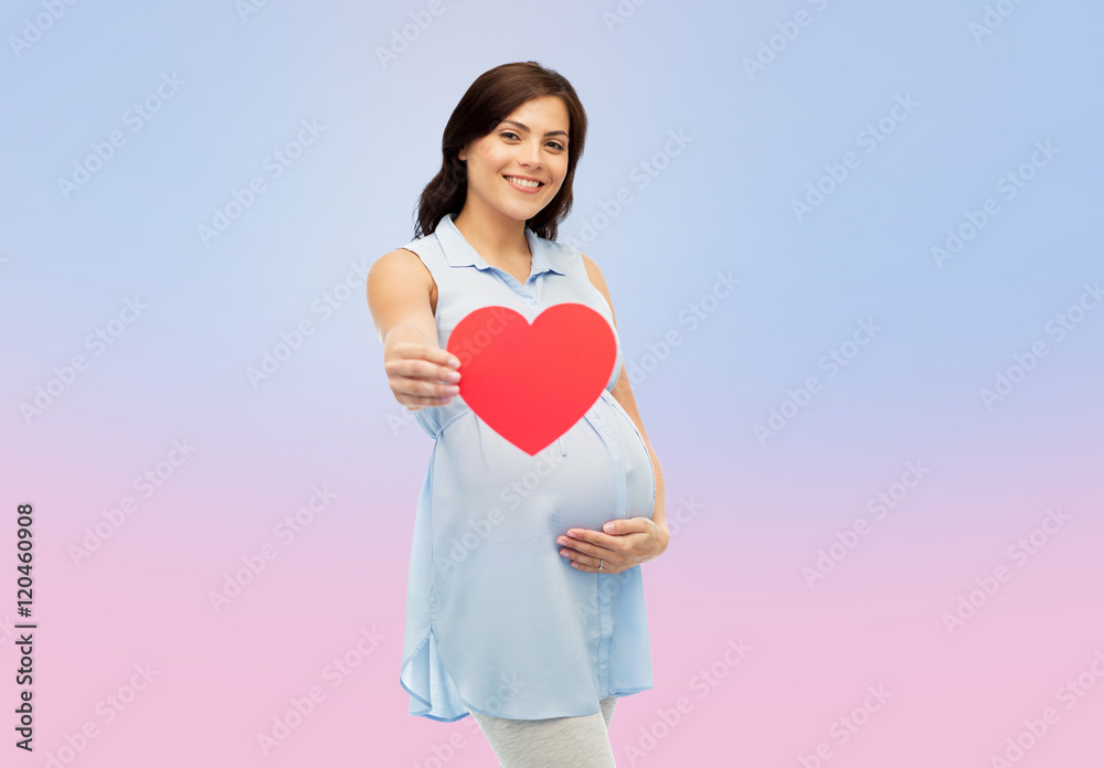 happy pregnant woman with red heart touching belly happy pregnant woman with red heart touching belly