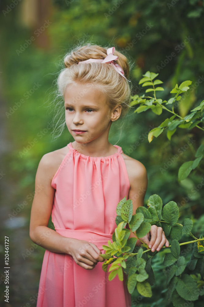Portrait of a child, among the green shrubs 6637. Portrait of a child, among the green shrubs 6637.