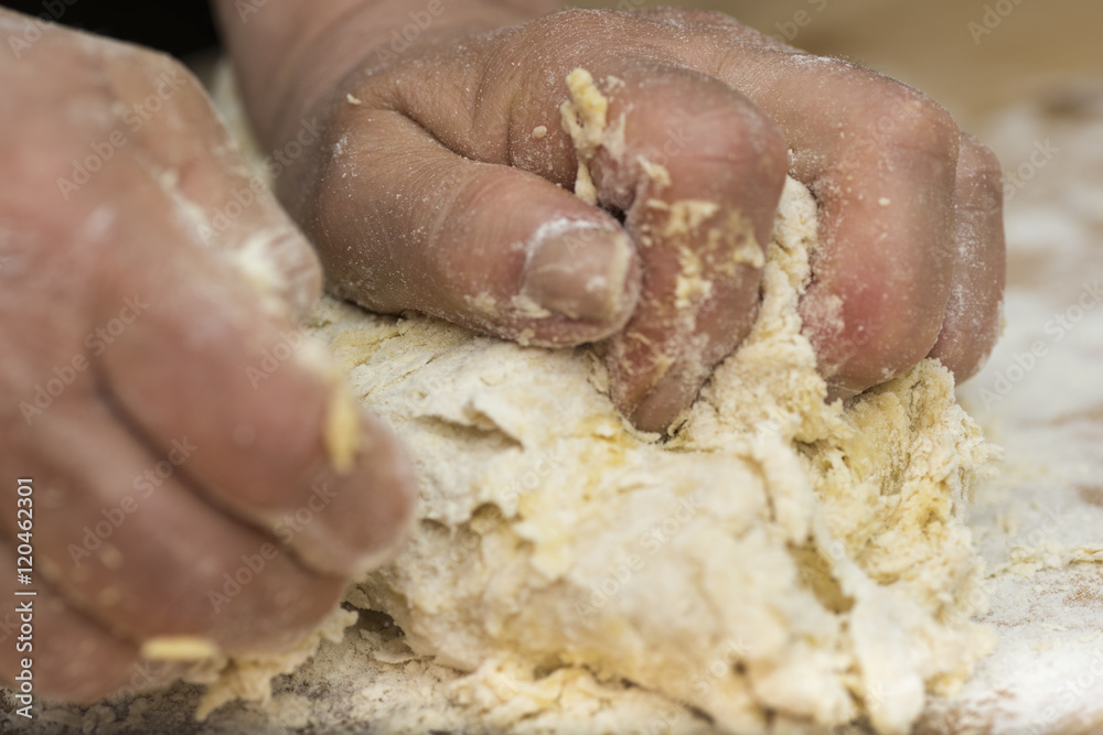Woman who kneads the homemade pasta to prepare lasagna and tagliatelle. Woman who kneads the homemade pasta to prepare lasagna and tagliatelle.