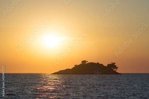 golden sunset with an island
