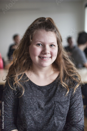 Portrait of schoolgirl (12-13) in classroom photo