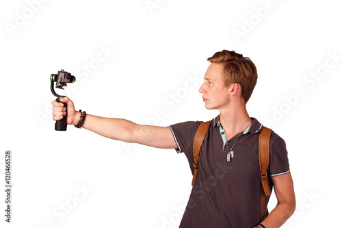 Videographer holds mobile camera on gimbal. © PaulShlykov