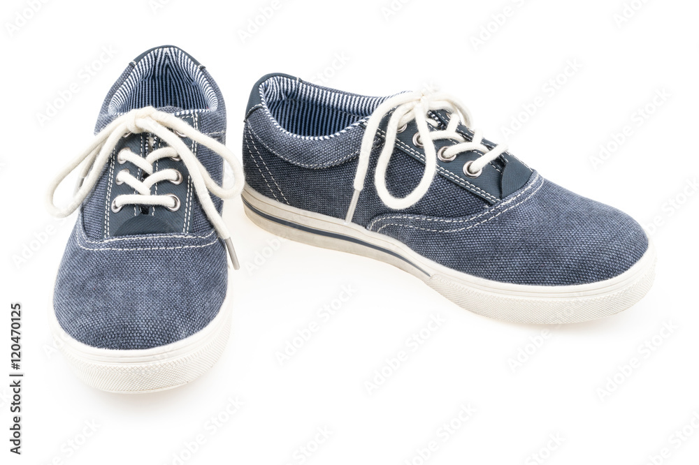 Picture of a pair of blue trainers over a white background.