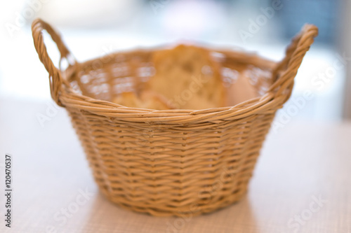 Wooden bread basket. Selective focus