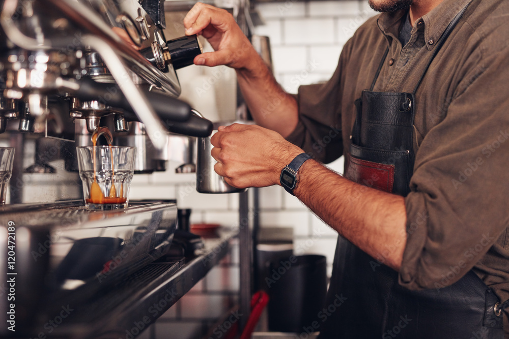 Barista making coffee using a coffee maker Barista making coffee using a coffee maker