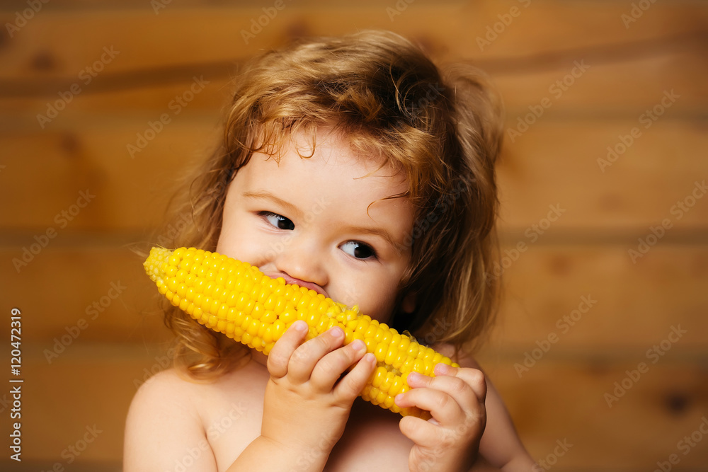 funny small boy child eating yellow corn funny small boy child eating yellow corn