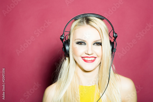 pretty blonde dg girl in headset on pink