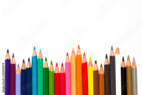Row of color pencil on white background
