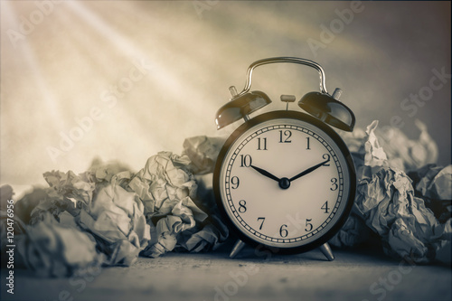 Alarm clock in a wastepaper
