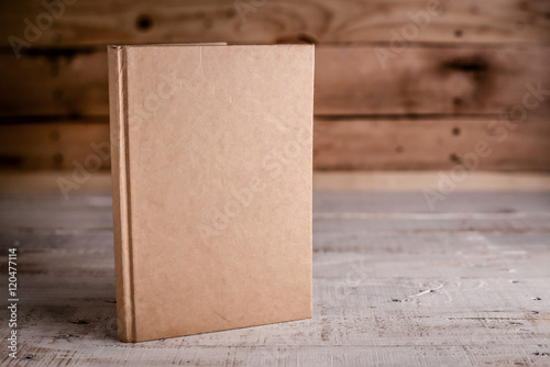 blank sketchbook on wooden floor