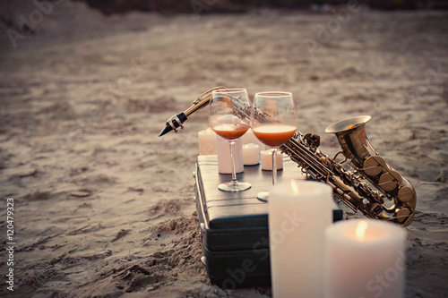 Photography glasses of wine lying on the beach