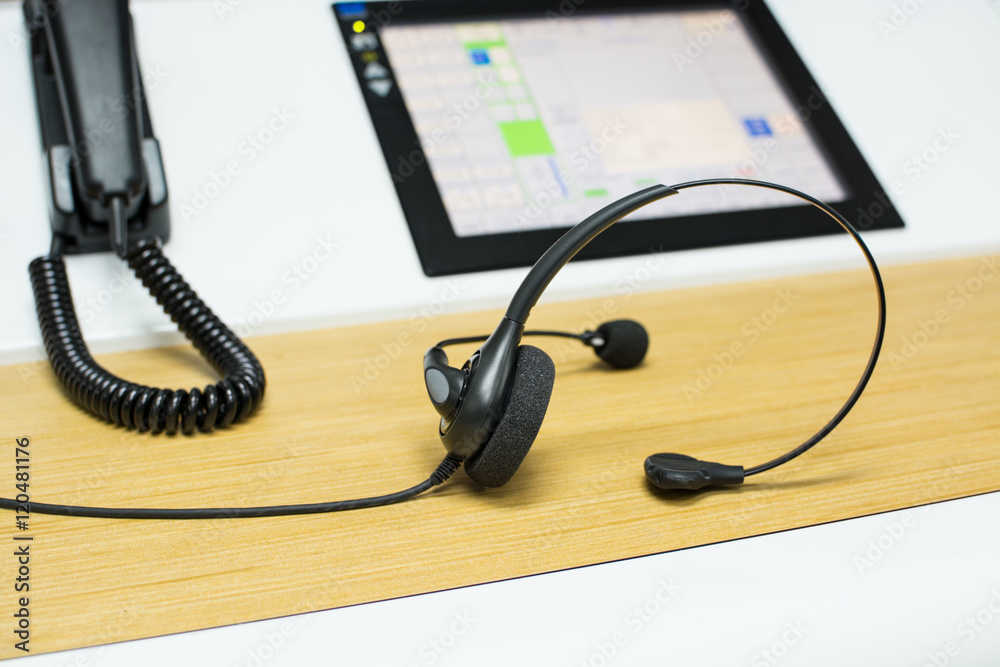 Headset with microphone , phone , lcd monitor - controller or call center concept Headset with microphone , phone , lcd monitor - controller or call center concept
